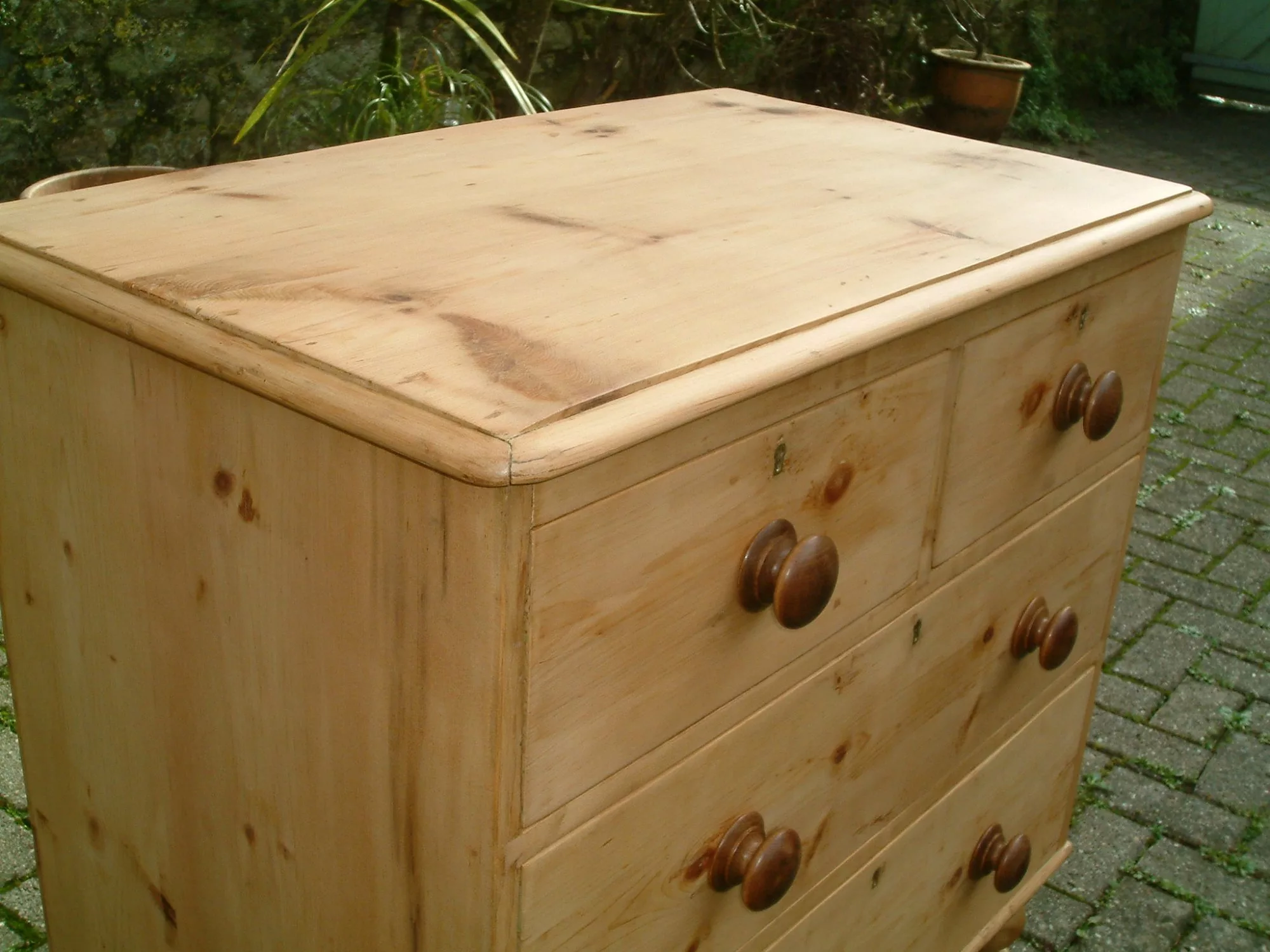 Image of the bead on the top of the antique pine chest of drawers