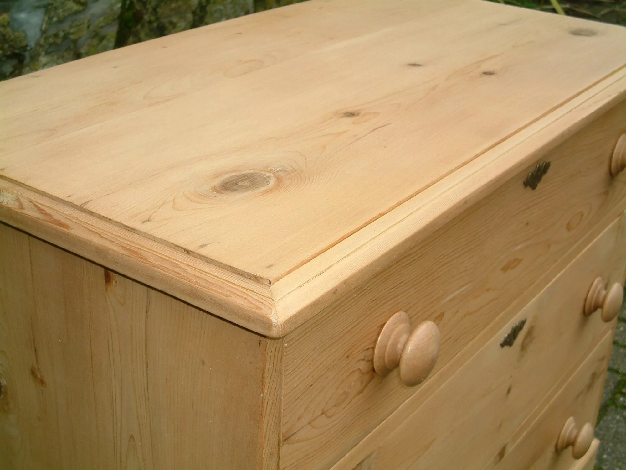 Image of the top bead on the antique pine chest of drawers.