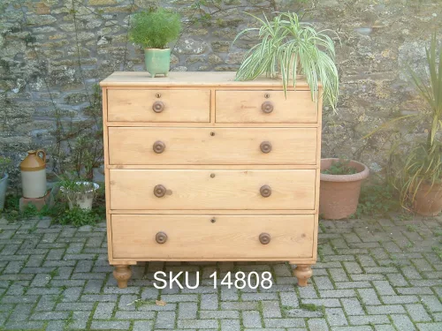 Antique pine chest of drawers front with floral decoration