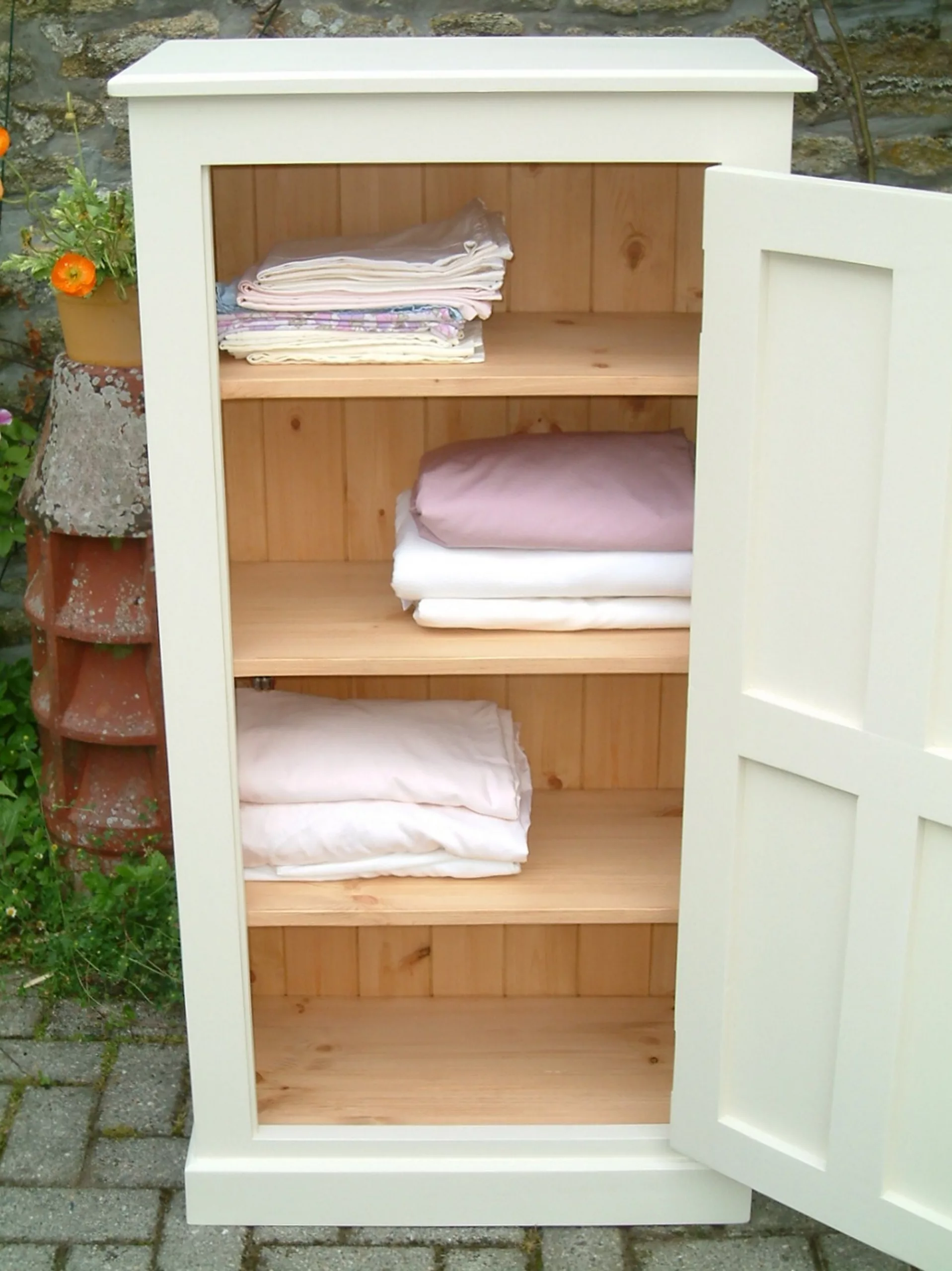 painted pine cupboard - showing linen use